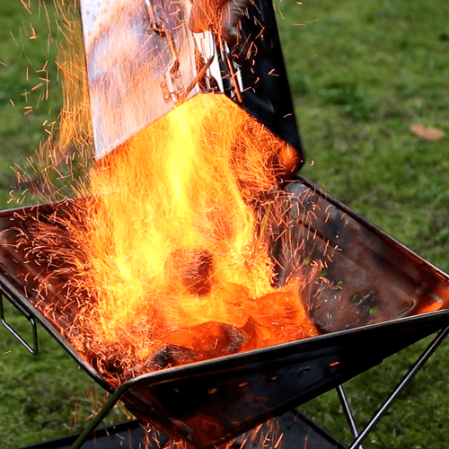 Folding Charcoal Starter, pouring charcoal into Quokka fire pit